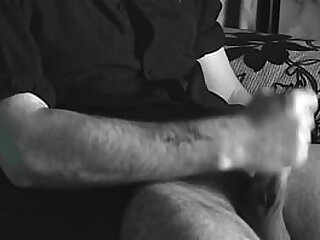 The boy jerks off close-up with a condom and cums loudly into it&period;