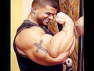 Massive Bodybuilder Castro‘s huge biceps flexing…
