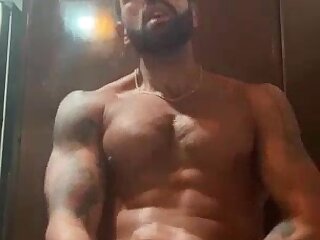 Hot muscular bearded guy cumming