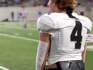 Football player on the sidelines.