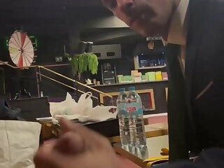 Man in a suit sucking a big cock